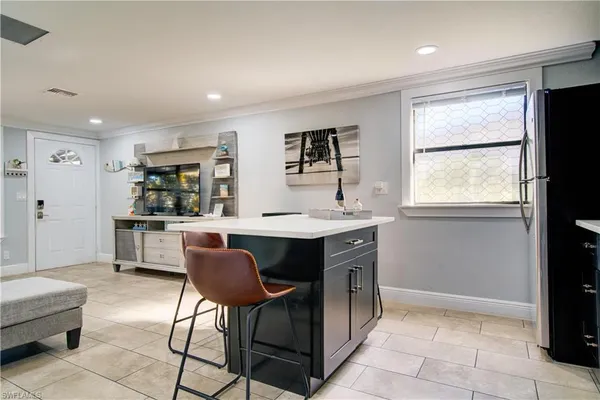 a kitchen with a table and chairs in it