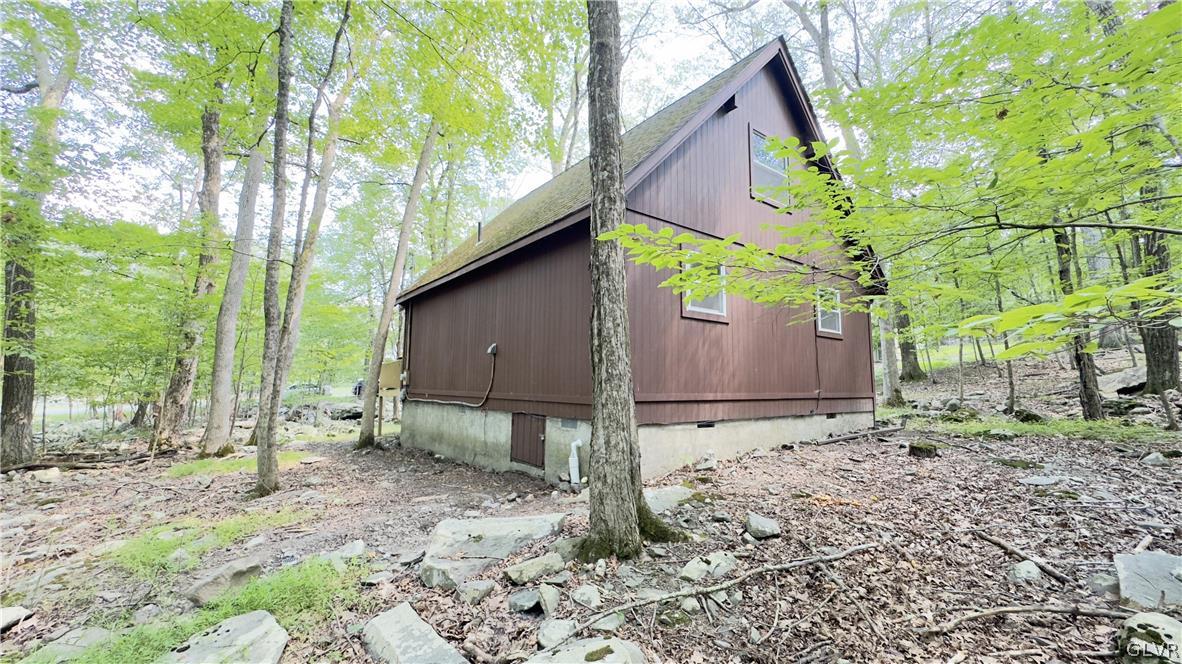 239 Saunders Drive Bushkill, PA 18324 - Photo 14 of 26 a backyard of a house with lots of green space