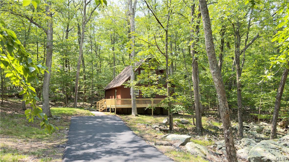 239 Saunders Drive Bushkill, PA 18324 - Photo 15 of 26 a view of a house with a tree in the background
