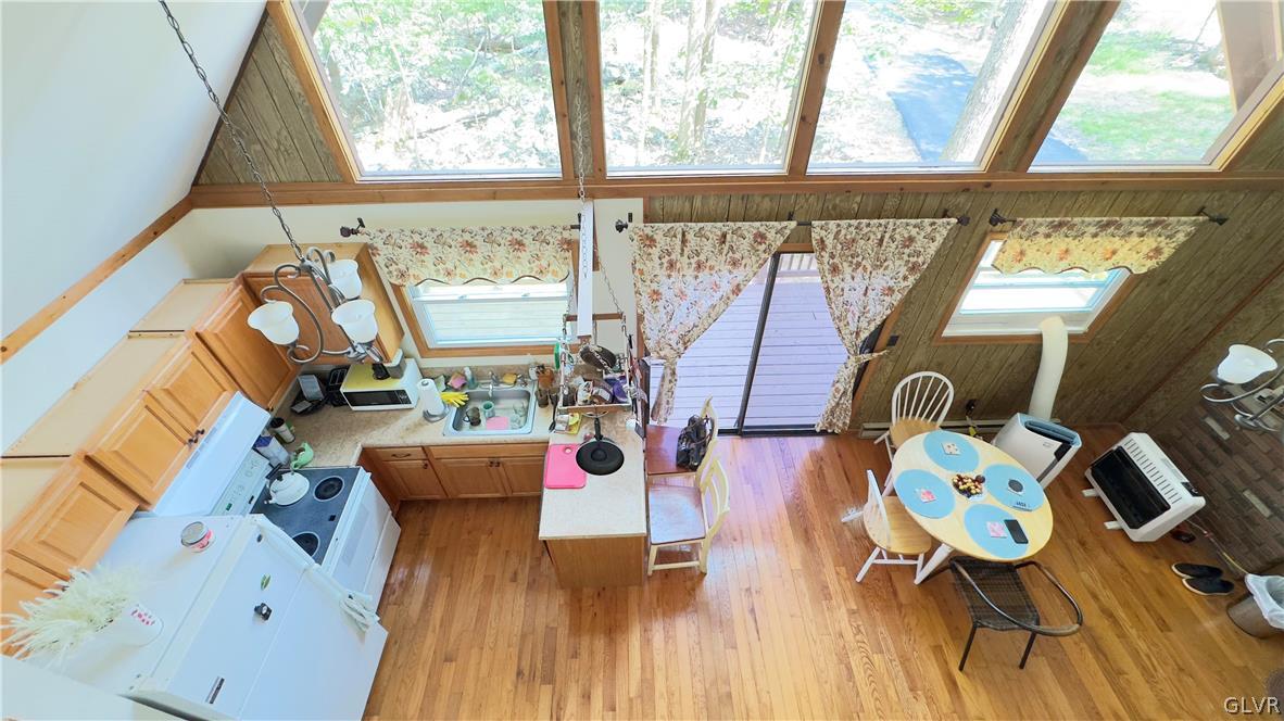 239 Saunders Drive Bushkill, PA 18324 - Photo 6 of 26 a view of living room filled with furniture and wooden floor