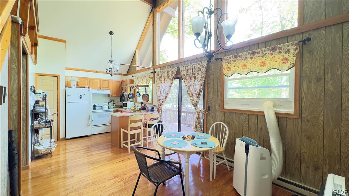 239 Saunders Drive Bushkill, PA 18324 - Photo 7 of 26 a view of a dining room with furniture window and wooden floor