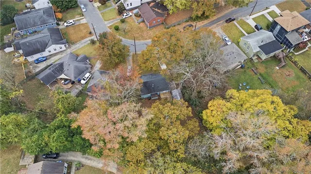 an aerial view of residential house with parking