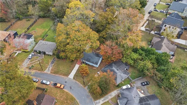 an aerial view of a house with outdoor space