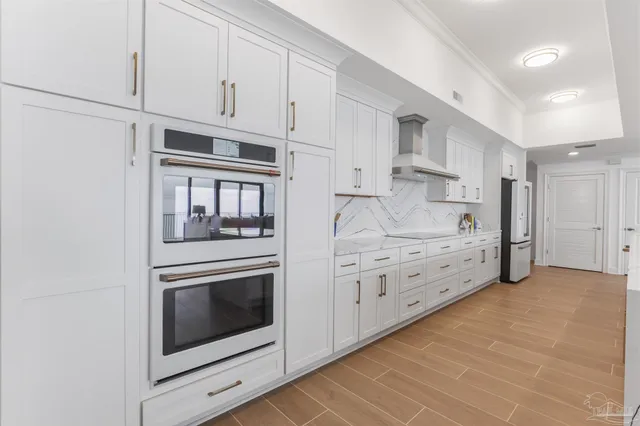 a living room with furniture fireplace and a large window