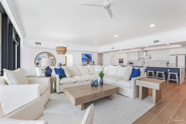 a living room with furniture or couches and a large window