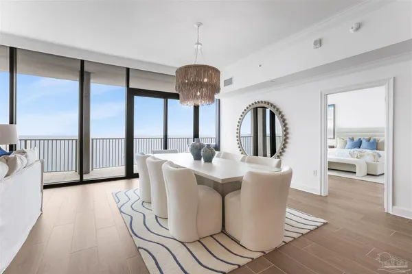 a view of a dining room with furniture and wooden floor