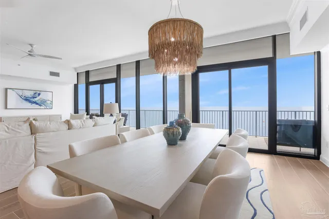 a spacious bedroom with a large bed and a large window