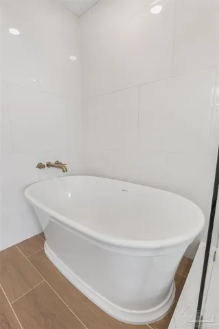 a bed room with a bed and a chandelier