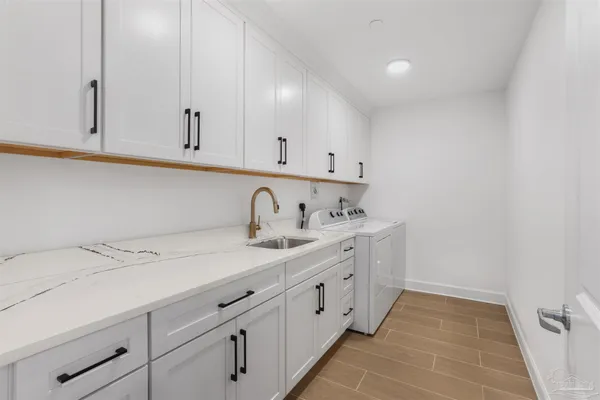 a bedroom with two beds and a painting on the wall