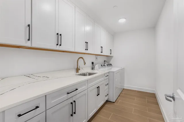 a bedroom with two beds and a painting on the wall