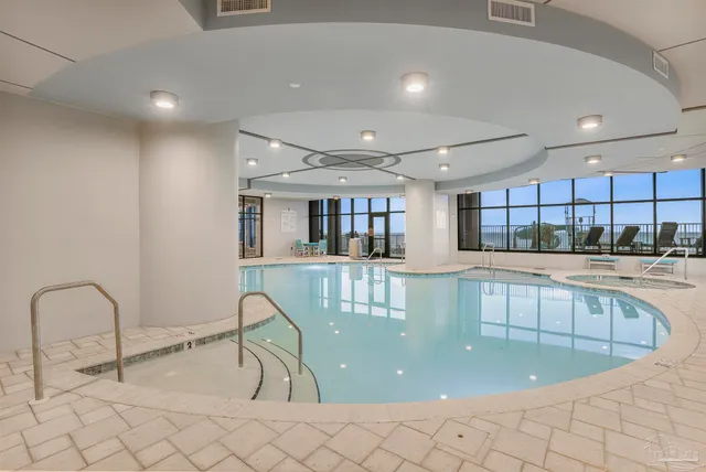 a view of a swimming pool with a seating space