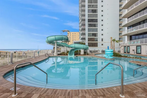 a view of a swimming pool with a yard