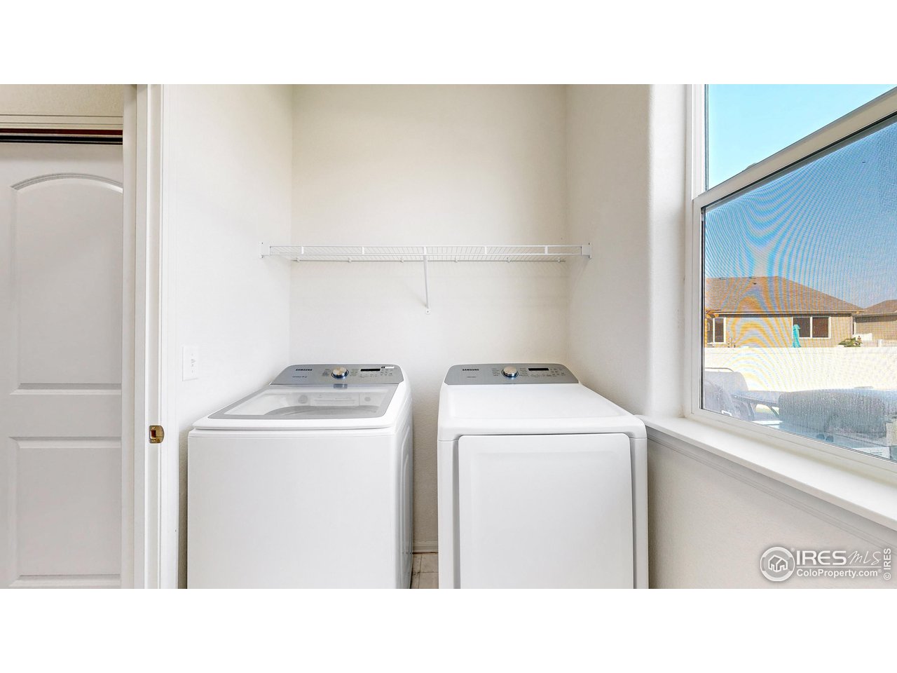 684 Takin Drive Severance, CO 80550 - Photo 14 of 38 a room with dryer and washer