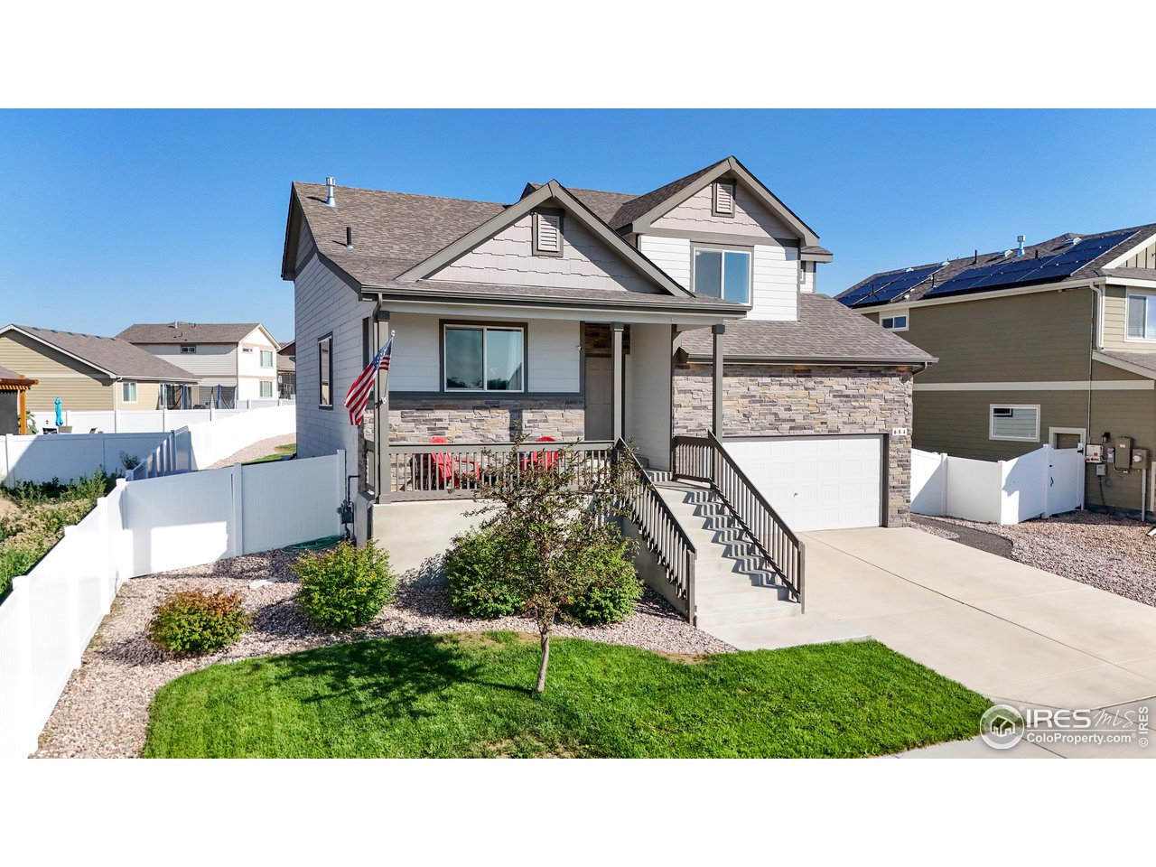 684 Takin Drive Severance, CO 80550 - Photo 2 of 38 a view of a house with a big yard plants and large tree