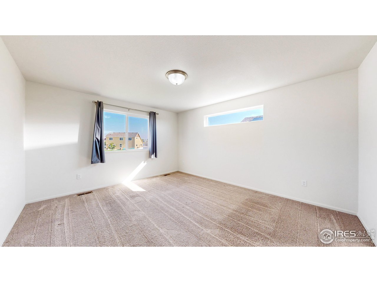 684 Takin Drive Severance, CO 80550 - Photo 22 of 38 a room with a bed