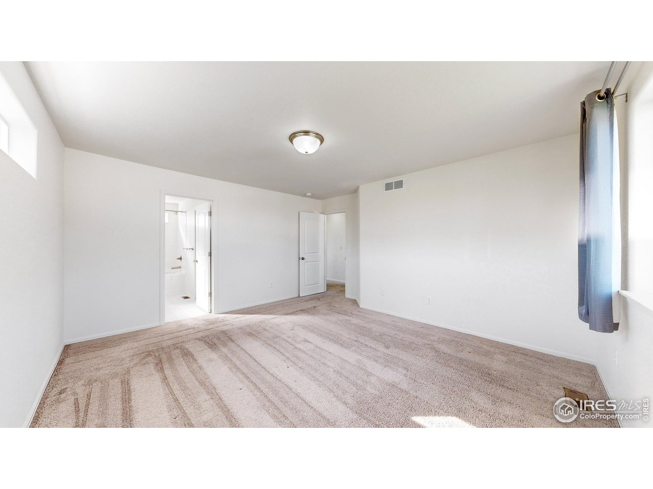 684 Takin Drive Severance, CO 80550 - Photo 24 of 38 a open hall with a bed