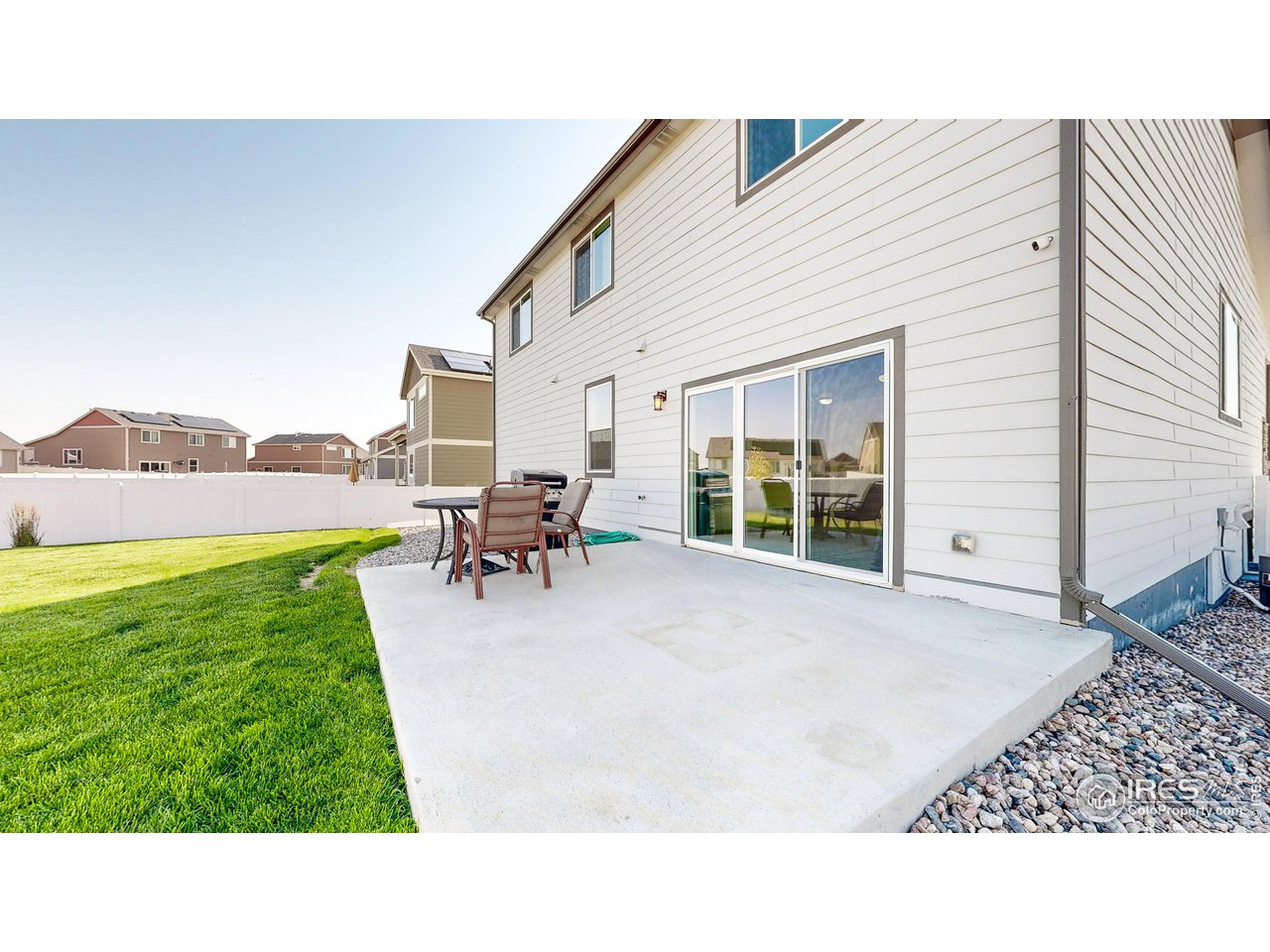 684 Takin Drive Severance, CO 80550 - Photo 30 of 38 a backyard of a house with table and chairs