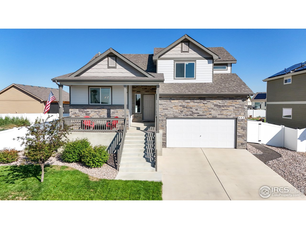 684 Takin Drive Severance, CO 80550 - Photo 3 of 38 a house view with a garden space