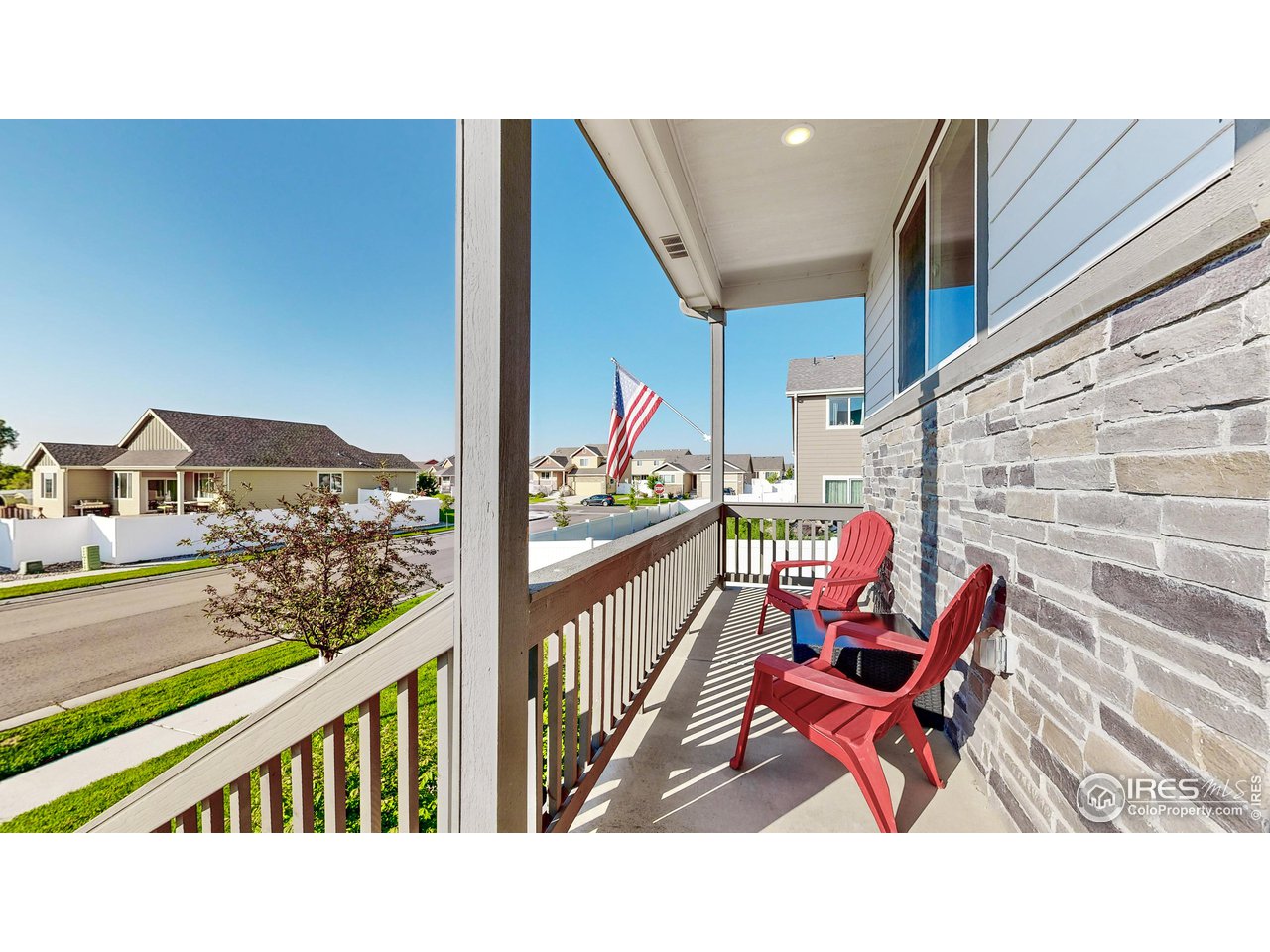 684 Takin Drive Severance, CO 80550 - Photo 4 of 38 a balcony with two chairs and a table