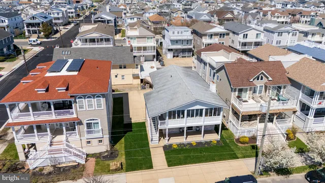 an aerial view of residential houses with street