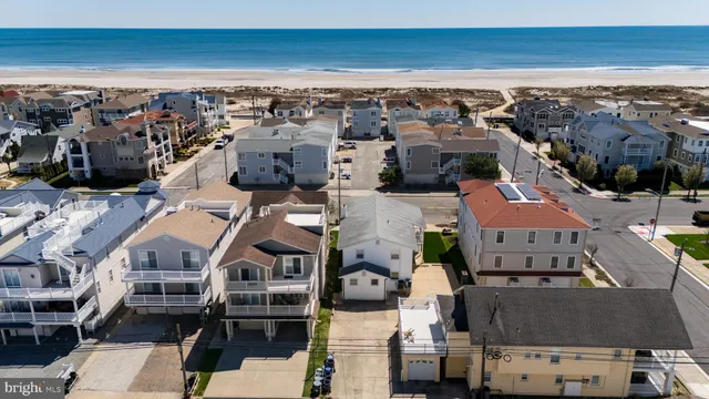 an aerial view of a building with parking