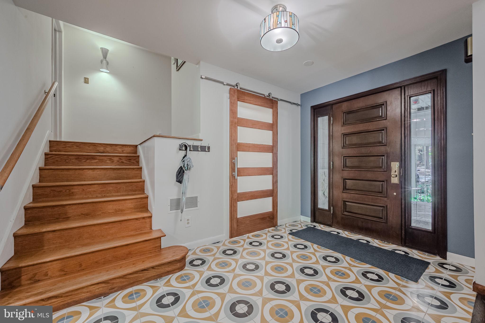 1805 Silverside Road Wilmington, DE 19810 - Photo 11 of 46 Stairwell to upper level/entry/half bath