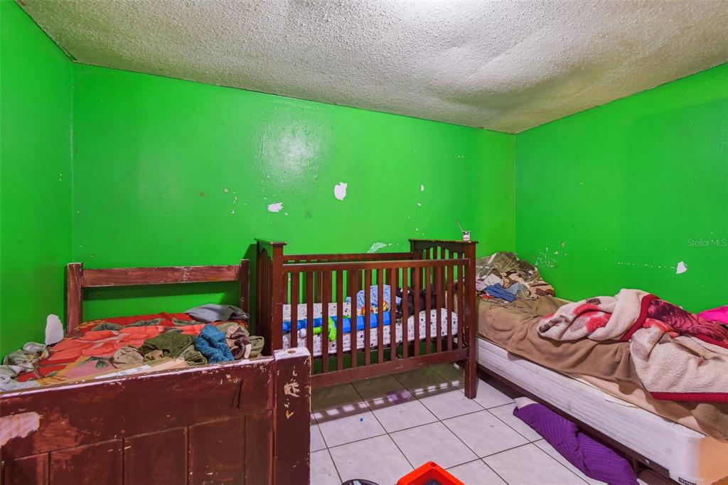 1805 East 139th Avenue, Unit 1 Tampa, FL 33613 - Photo 27 of 44 a view of a porch with furniture