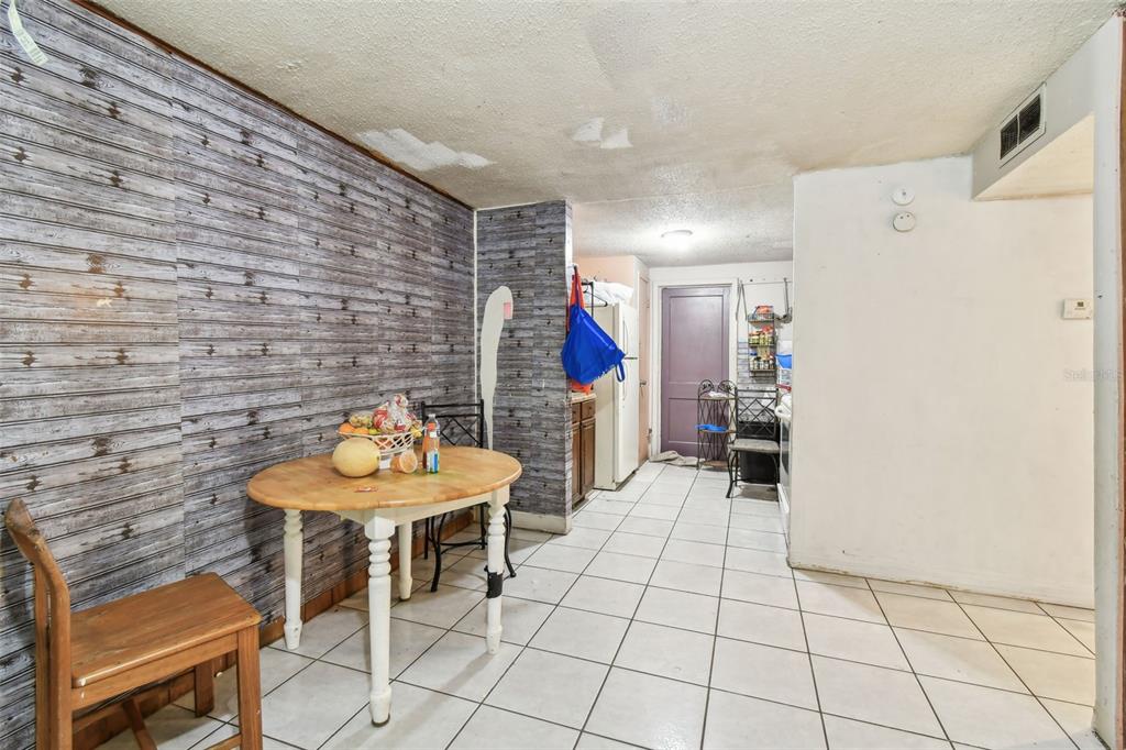 1805 East 139th Avenue, Unit 1 Tampa, FL 33613 - Photo 28 of 44 a living room with furniture and a table