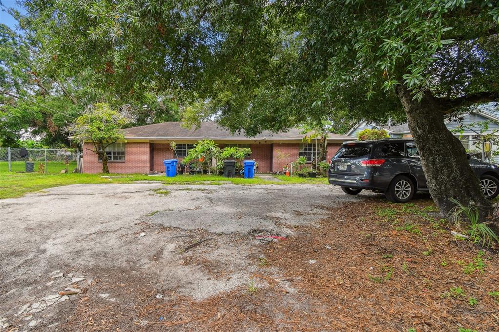 1805 East 139th Avenue, Unit 1 Tampa, FL 33613 - Photo 30 of 44 a front view of a house with garden