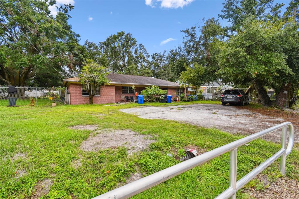 1805 East 139th Avenue, Unit 1 Tampa, FL 33613 - Photo 31 of 44 a view of a house with garden and sitting area