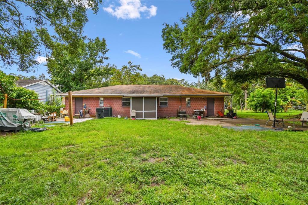 1805 East 139th Avenue, Unit 1 Tampa, FL 33613 - Photo 33 of 44 a front view of a house with garden