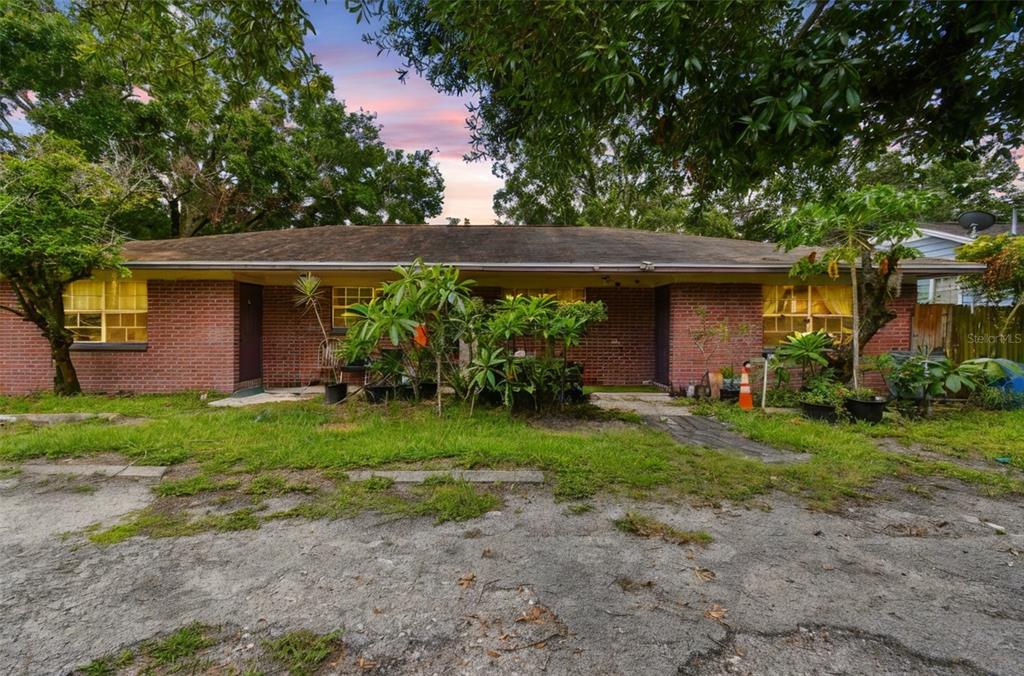 1805 East 139th Avenue, Unit 1 Tampa, FL 33613 - Photo 42 of 44 a front view of a house with garden