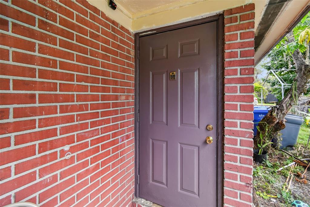 1805 East 139th Avenue, Unit 1 Tampa, FL 33613 - Photo 43 of 44 a view of front door and porch