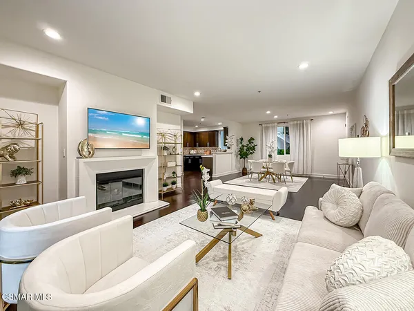 a living room with furniture fireplace and a fireplace