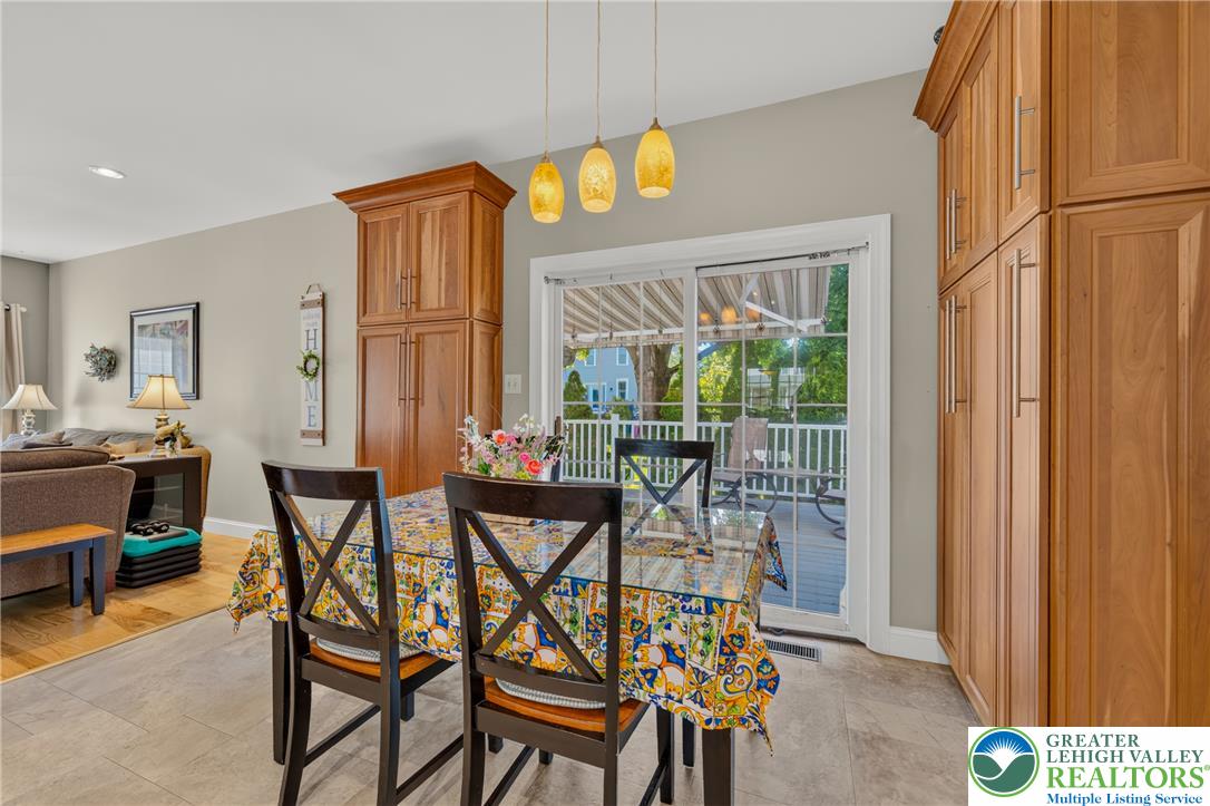 1702 Red Bud Road Quakertown, PA 18951 - Photo 17 of 68 Dine in comfort with seamless access to outdoor living through the glass sliding doors leading to a spacious deck.