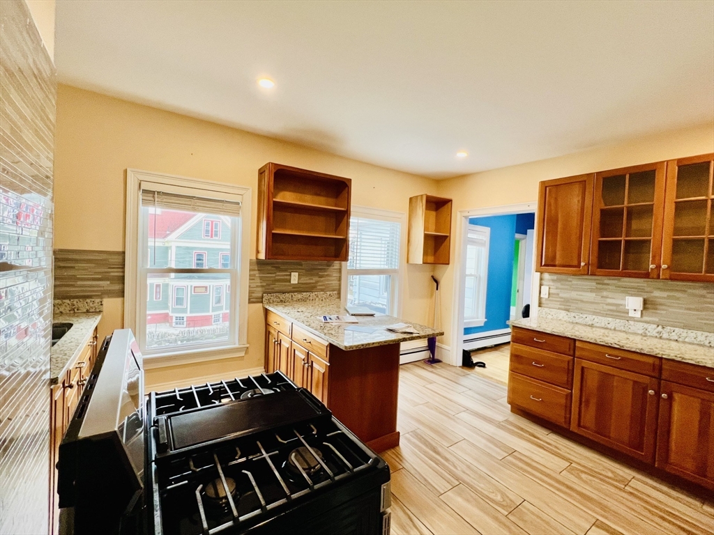 249 Chatham Street Lynn, MA 01902 - Photo 12 of 42 a kitchen with a stove and a sink