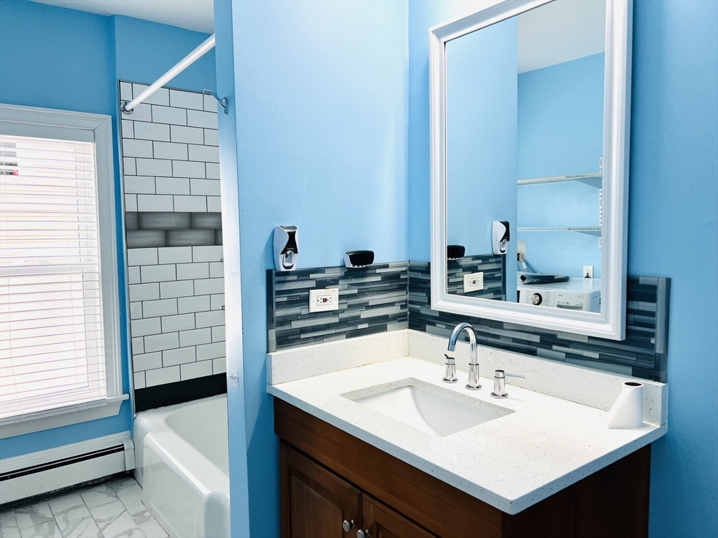 249 Chatham Street Lynn, MA 01902 - Photo 15 of 42 a bathroom with a sink and a mirror