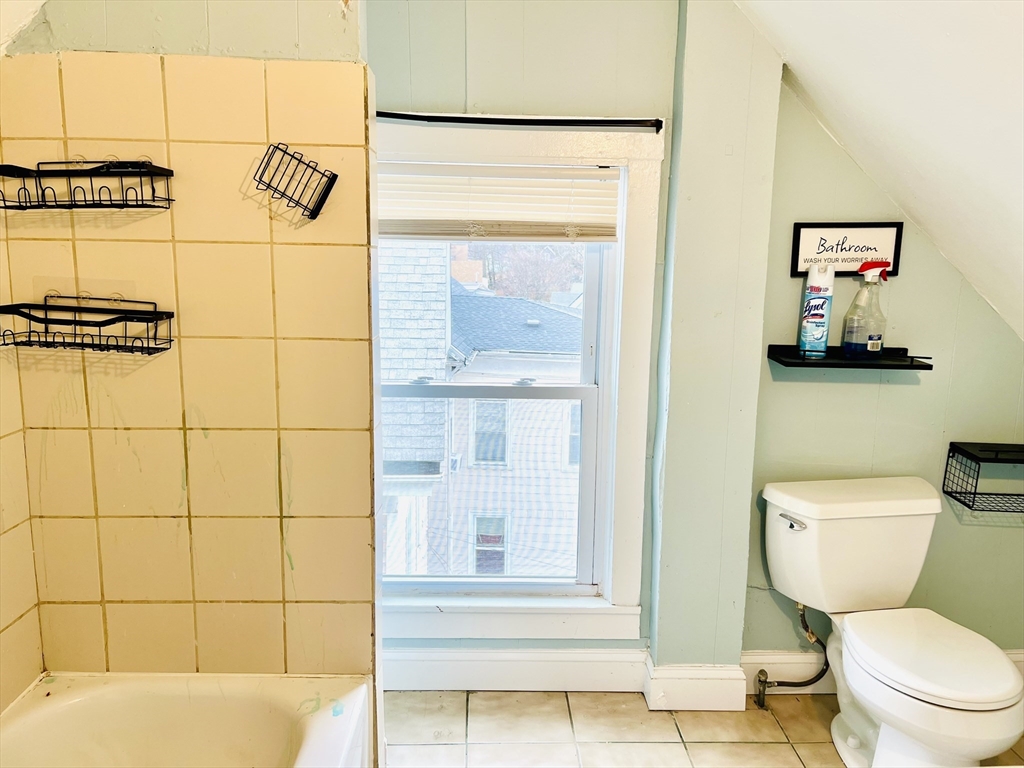 249 Chatham Street Lynn, MA 01902 - Photo 19 of 42 a bathroom with a toilet and a shower