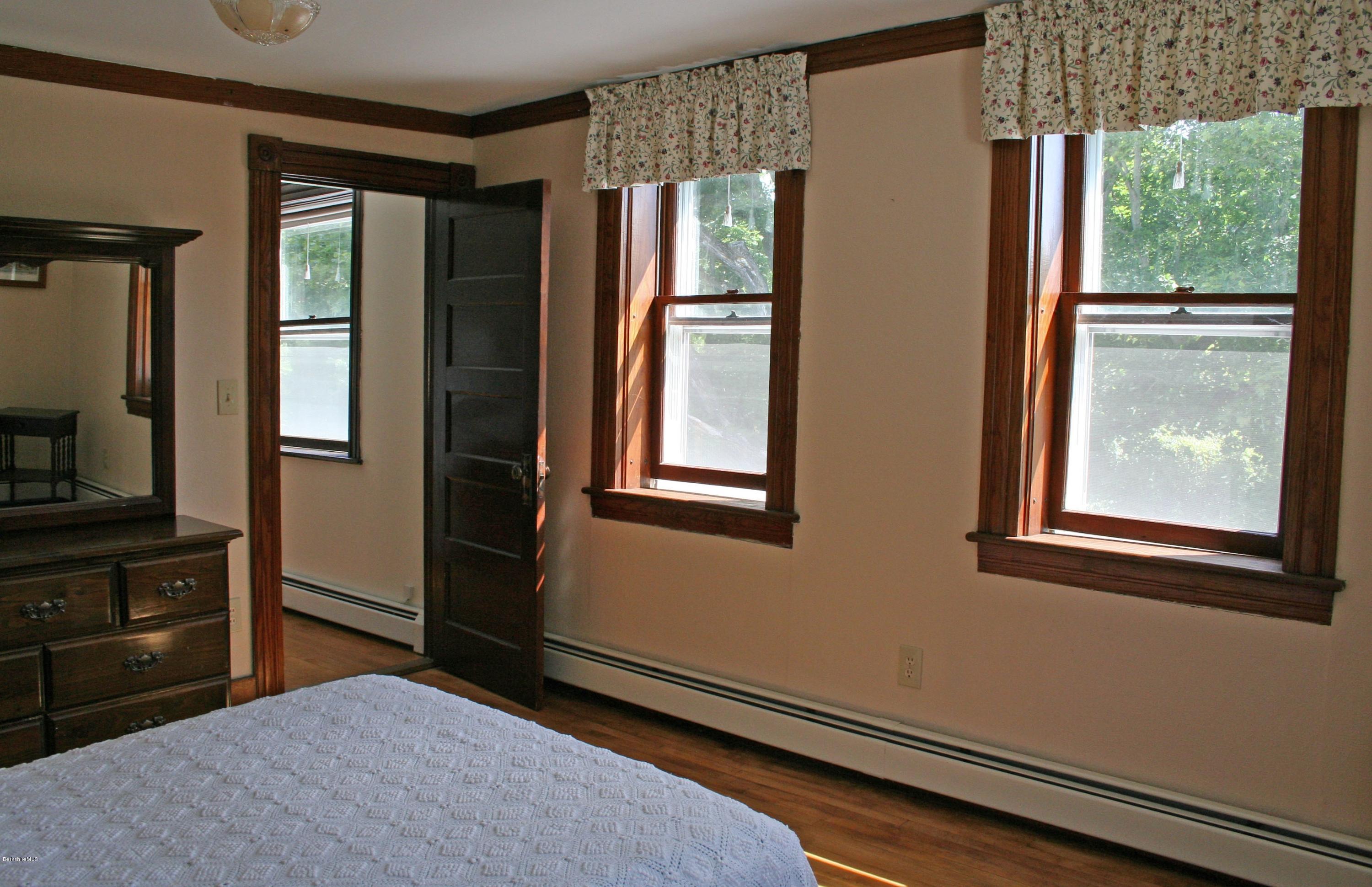 134 West Center Road West Stockbridge, MA 01266 - Photo 19 of 28 a bedroom with a bed and large window