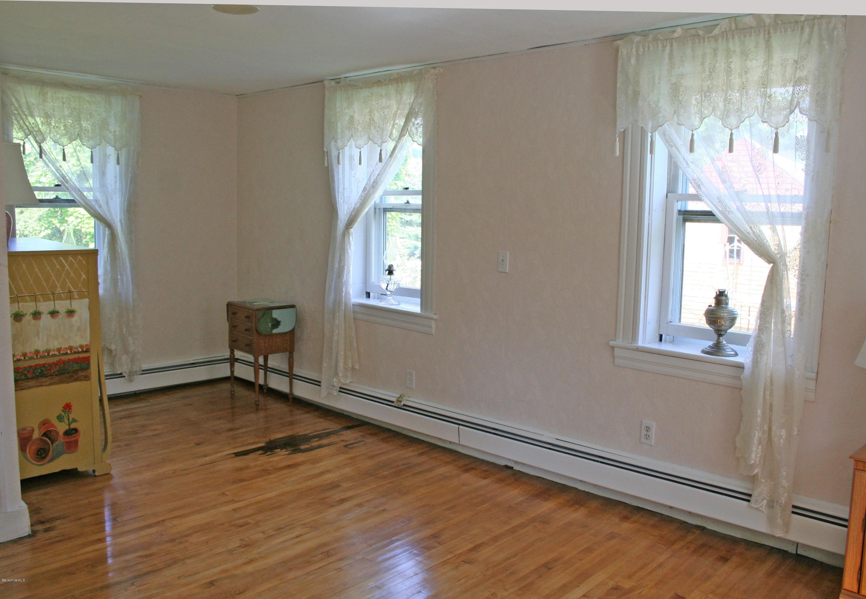 134 West Center Road West Stockbridge, MA 01266 - Photo 20 of 28 wooden floor in an empty room with a window