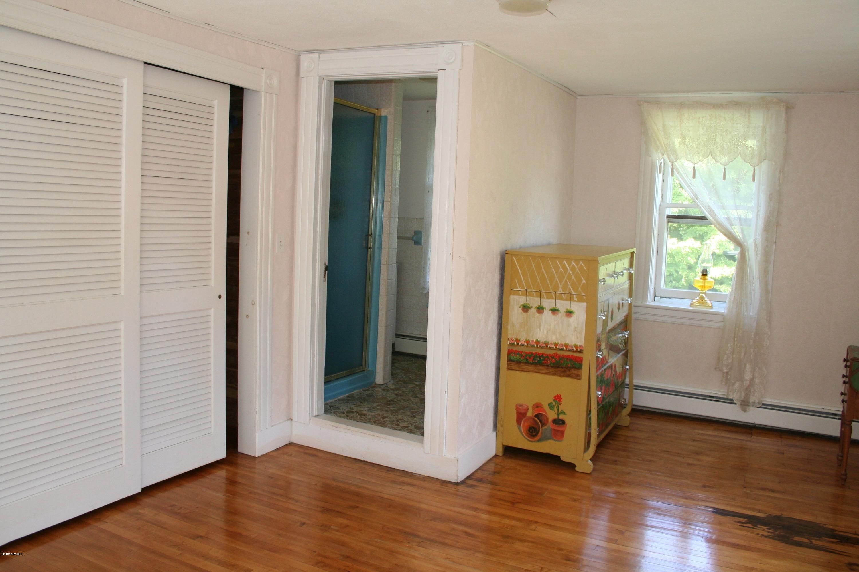 134 West Center Road West Stockbridge, MA 01266 - Photo 21 of 28 wooden floor in an empty room with a window