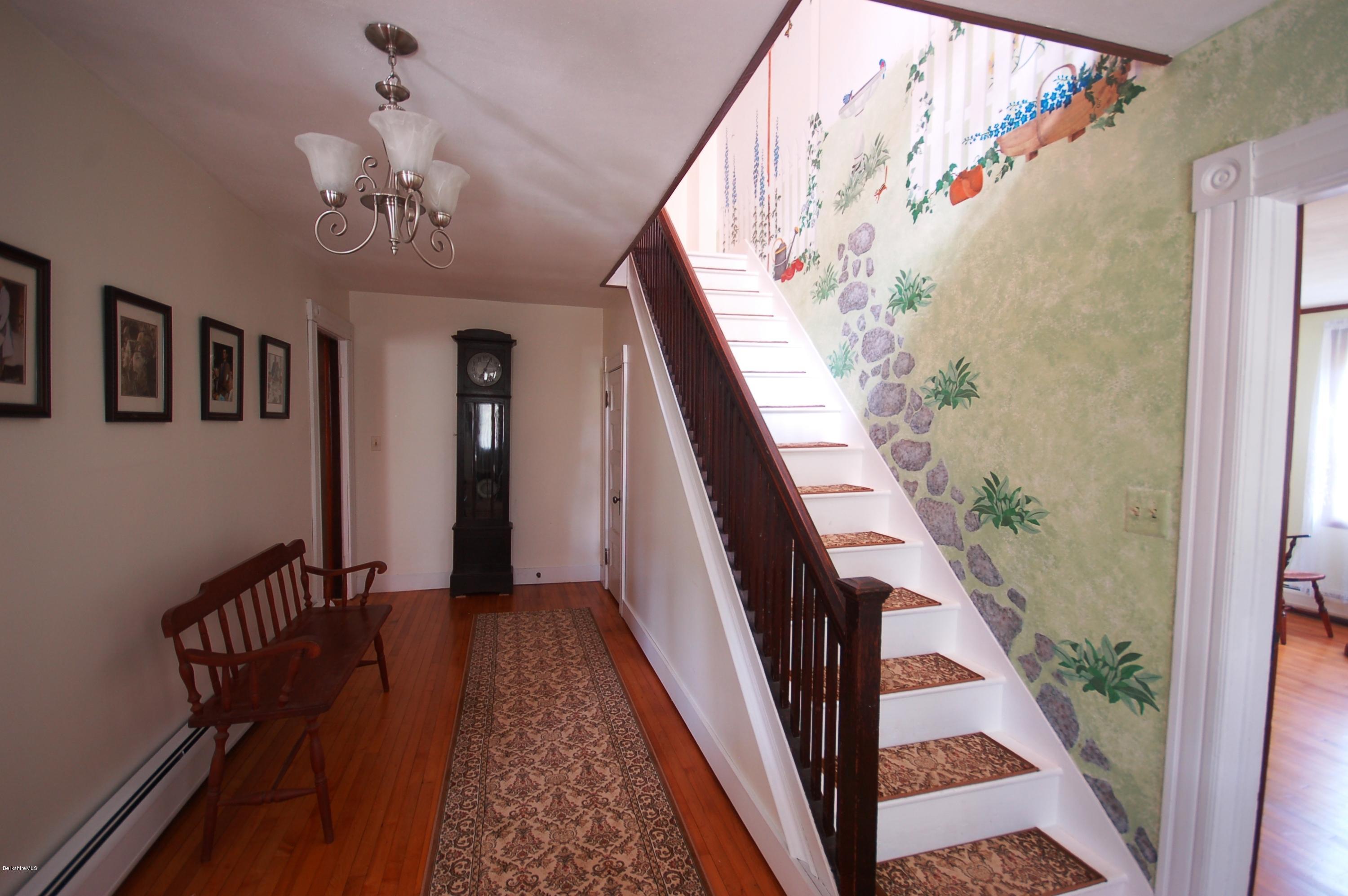 134 West Center Road West Stockbridge, MA 01266 - Photo 5 of 28 a view of a hallway with wooden floor and staircase