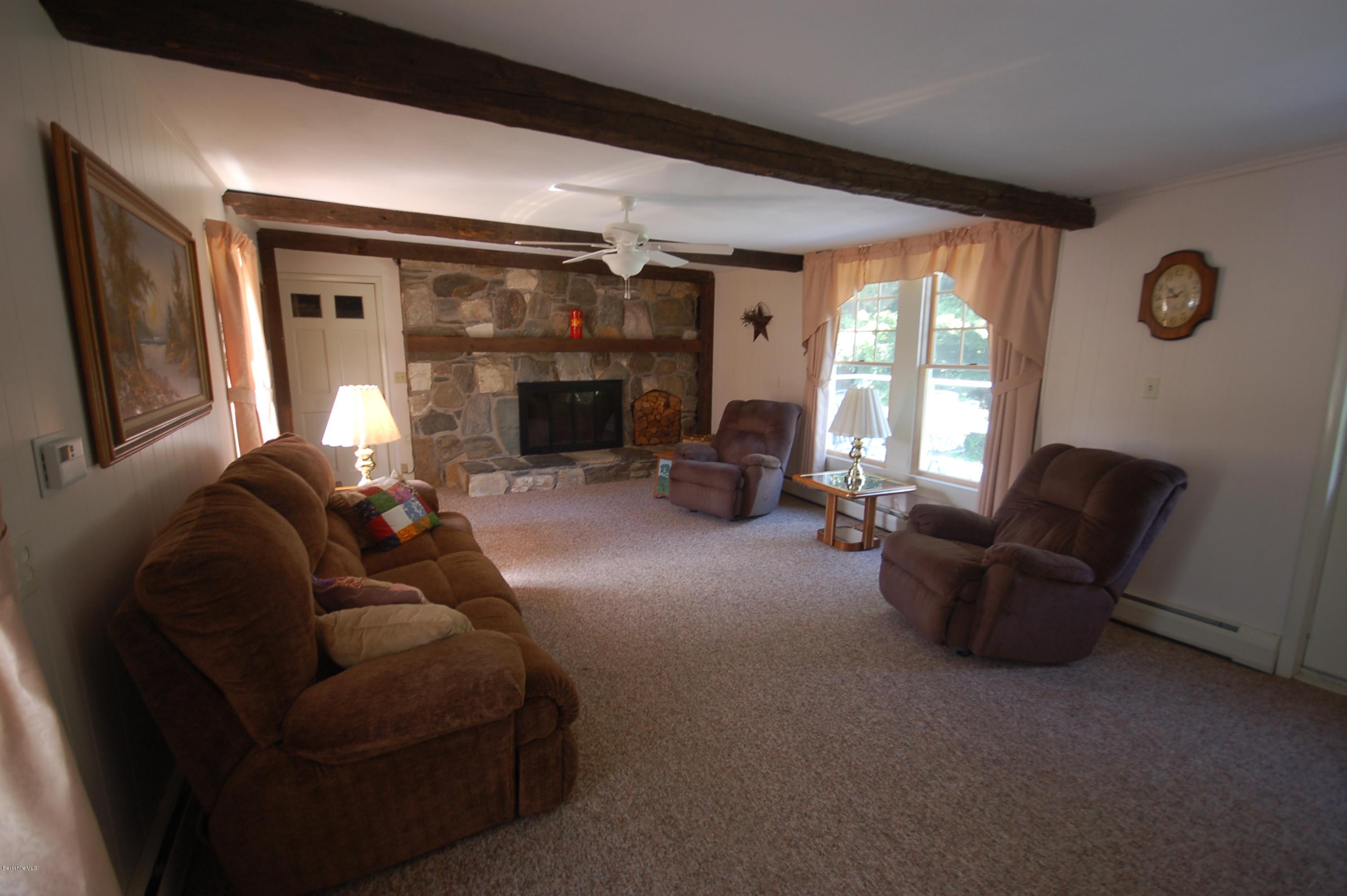134 West Center Road West Stockbridge, MA 01266 - Photo 6 of 28 a living room with furniture and a fireplace