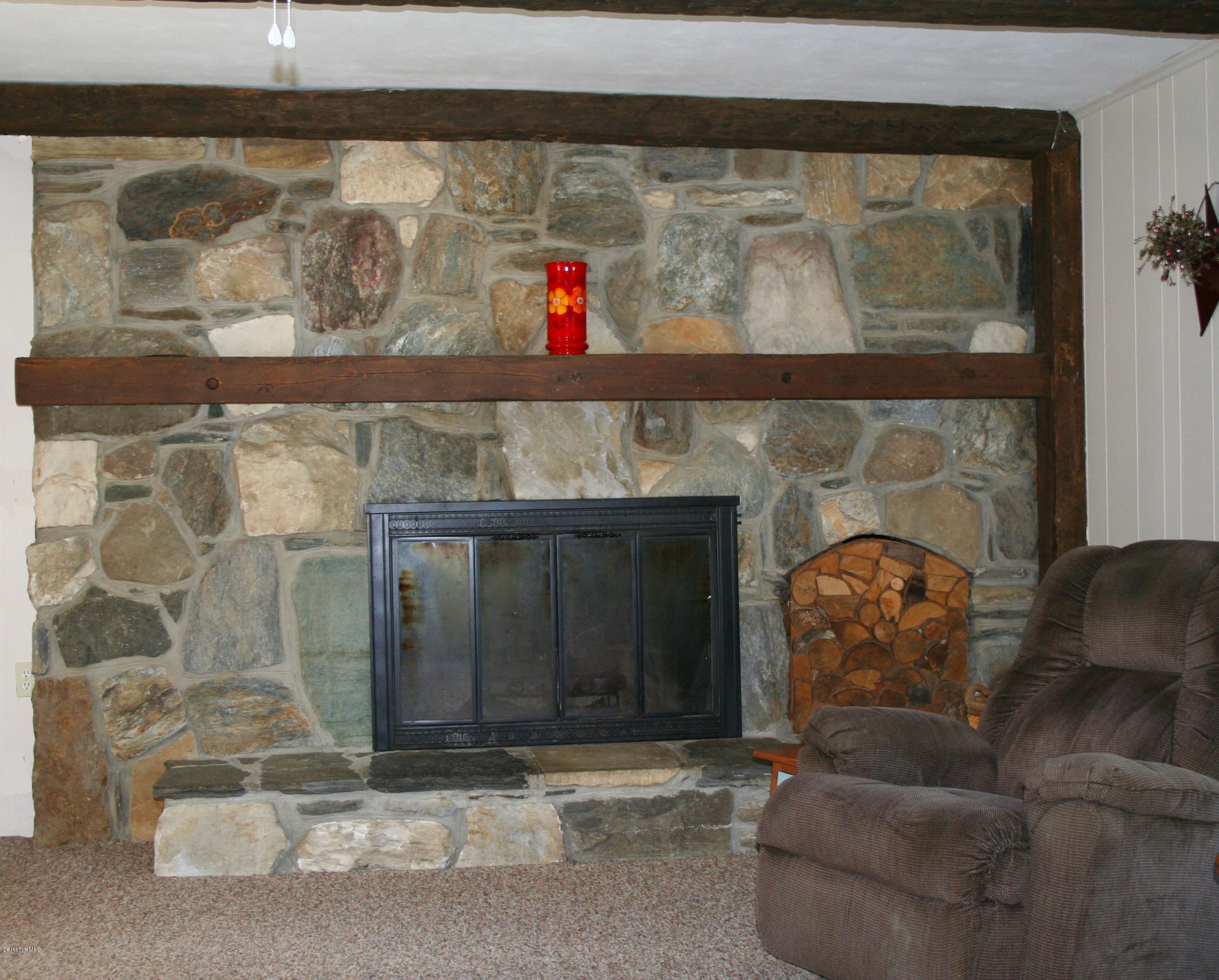 134 West Center Road West Stockbridge, MA 01266 - Photo 7 of 28 a living room with a fireplace