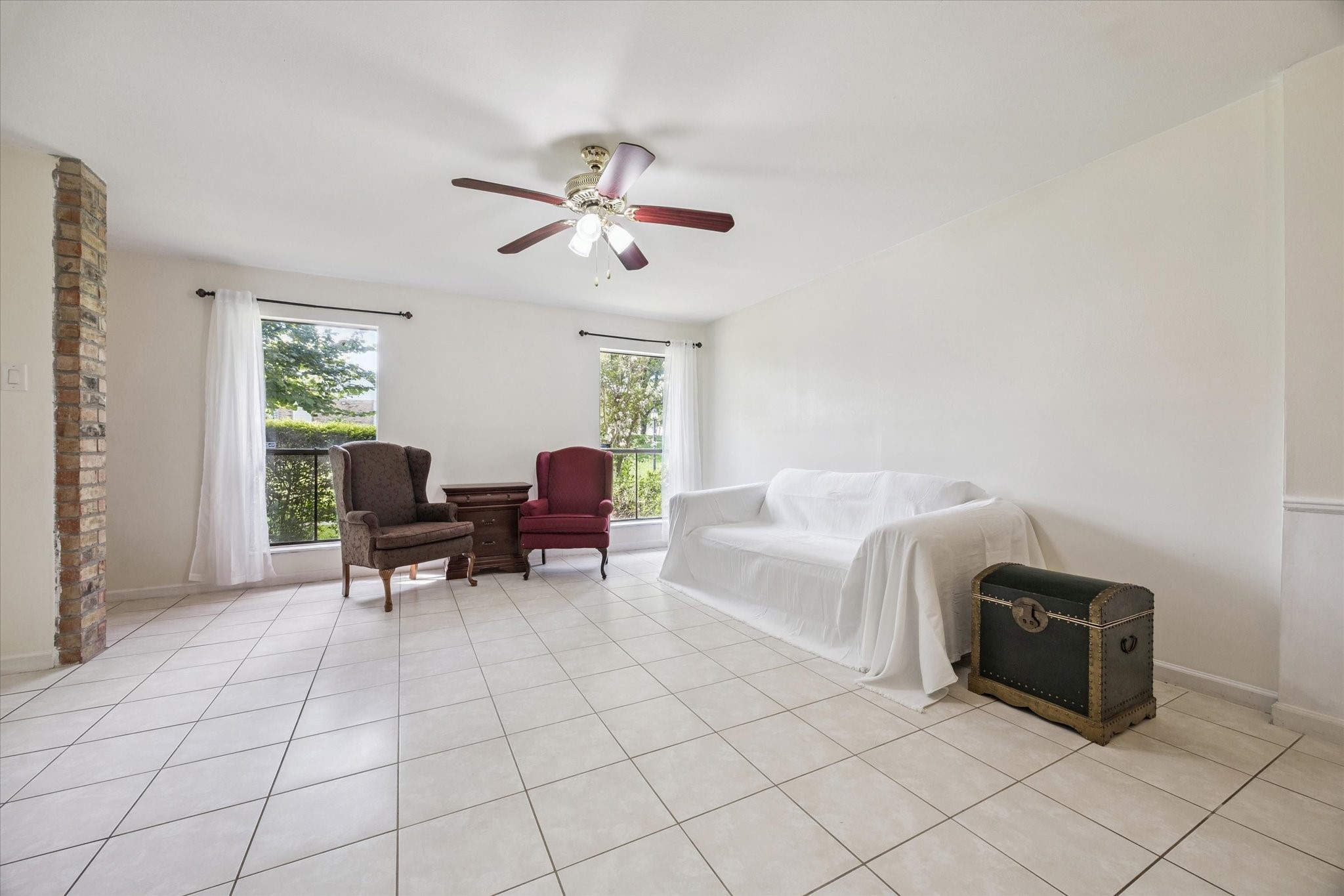 6517 Wanda Lane Houston, TX 77074 - Photo 5 of 29 The living room overlooks the beautiful green space outside. Fresh paint in a subtle neutral tone allows for easy personalization and decorating!