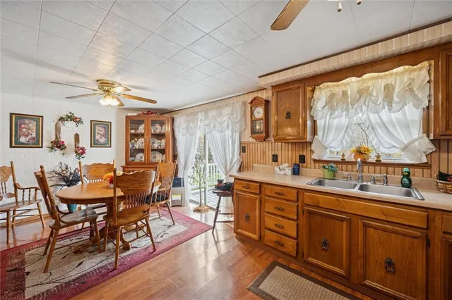 a view of a dining room with furniture window and wooden floor