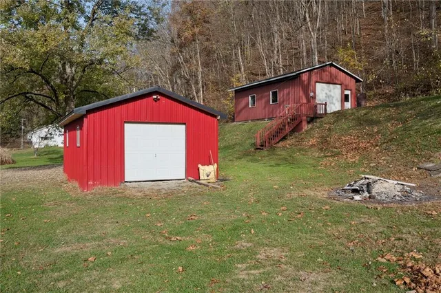 a view of a house with a yard and garage
