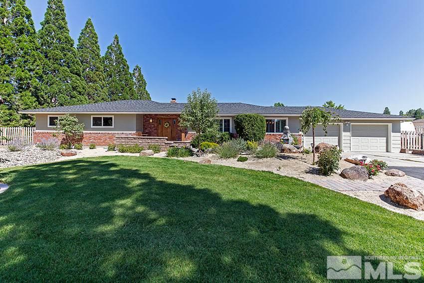 4240 Hackamore Drive Reno, NV 89519 - Photo 1 of 1 a view of a house with backyard sitting area and garden