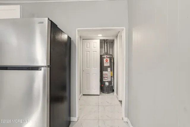 a bathroom with a shower and closet