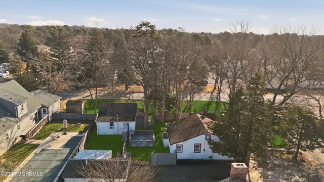 an aerial view of a house with mountain view